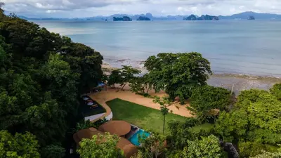 an aerial view of the beach and the ocean at Touch Beachfront Pool Villa Koh Yao Noi in Ko Yao Noi