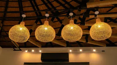 a group of lights hanging from a ceiling at Touch Beachfront Pool Villa Koh Yao Noi in Ko Yao Noi