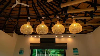 a group of lights hanging from a ceiling at Touch Beachfront Pool Villa Koh Yao Noi in Ko Yao Noi