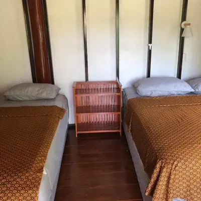 two beds sitting next to each other in a room at Lok Mun Bungalows in Ko Yao Noi