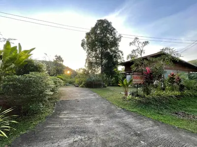 a dirt road in front of a house at Lok Mun Bungalows in Ko Yao Noi