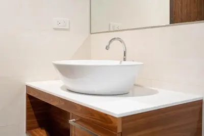 a bathroom with a white bowl sink on a counter at The Title Rawai Beach West Wing by EHM in Rawai Beach