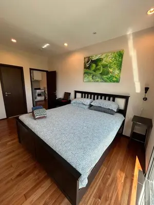 a bedroom with a large bed in a room at The Title Rawai Beach West Wing by EHM in Rawai Beach