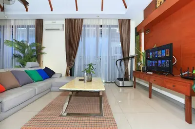 a living room with a couch and a tv at 3bedroom pool villa only 250m to the Rawai beach F10 in Phuket Town