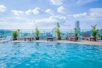 a swimming pool on the roof of a building with a view at Add Plus Hotel & SPA in Patong Beach