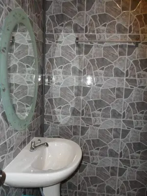 a bathroom with a sink and a mirror at Life&Love Resort in Ban Khlong Son