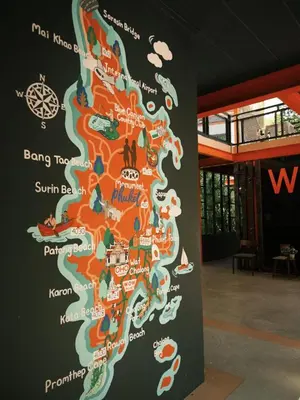 a wall with a map of the united kingdom at WOW PHUKET in Phuket Town
