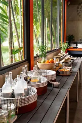 a buffet line with food and drinks on a table at WOW PHUKET in Phuket Town
