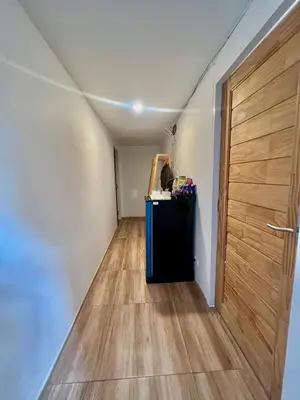 a room with a hallway with a wooden door at patong sunset villa Phuket in Patong Beach