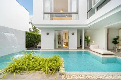 a villa with a swimming pool and a house at Villa Casa Koko - Luxury Modern Minimalism in Thalang