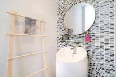 a bathroom with a sink and a mirror at Villa Casa Koko - Luxury Modern Minimalism in Thalang