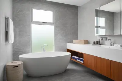 a bathroom with a white tub and a sink at Beachfront Residences - Stunning Sea and Lake View in Bang Tao Beach