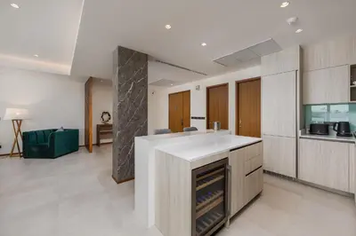 a kitchen with a white counter top in a room at Beachfront Residences - Stunning Sea and Lake View in Bang Tao Beach
