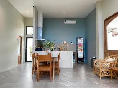 a kitchen and dining room with a table and chairs at Alleyhill Phuket - Private & Cozy Boutique in Phuket Town