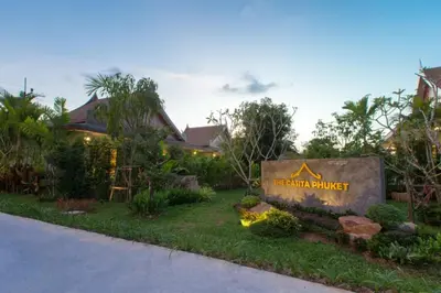 a sign for a resort in a yard at The Casita Phuket (SHA+) in Mai Khao Beach