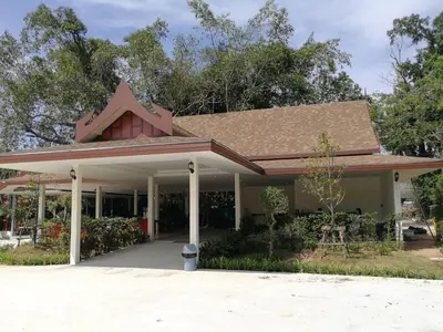 a building with a roof with a star on it at The Casita Phuket (SHA+) in Mai Khao Beach
