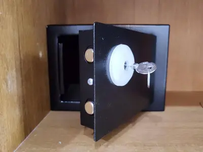 a black box with a door with a key in it at Kitty Guesthouse in Phi Phi Don
