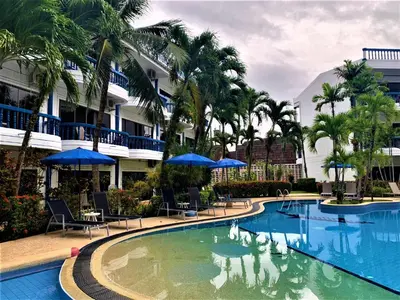 a pool at a resort with swans in it at Kamala - The Club Residence -2 BR Pool View Residence in Kamala Beach