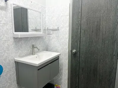 a bathroom with a sink and a mirror at 1BR Cozy House, Bangtao Beach in Ban Thalat Choeng Thale