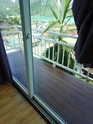 a sliding glass door with a view of a balcony at Blue View House Phi Phi in Phi Phi Don