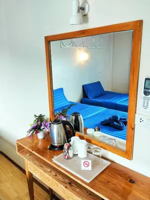 a mirror reflection of a bed in a room at Blue View House Phi Phi in Phi Phi Don