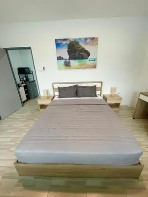 a bedroom with a large bed in a room at Garden Beach Sea View Patong in Patong Beach