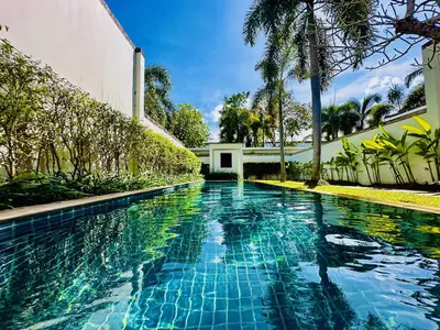 a swimming pool in the middle of a house at White Lotus by Oxygen at Bang Tao Beach in Ban Thalat Choeng Thale
