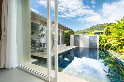 an external view of a house with a swimming pool at Sunpao Pool Villa by HCR in Layan Beach