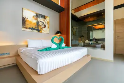 a bedroom with a bed with a swan decoration on it at Sunpao Pool Villa by HCR in Layan Beach