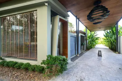 a house with a walkway in front of it at Sunpao Pool Villa by HCR in Layan Beach