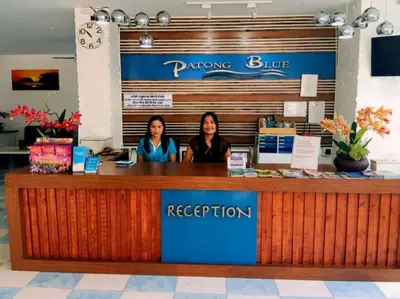 two women sitting at a reception counter in a store at PATONG BLUE HOTEL in Patong Beach