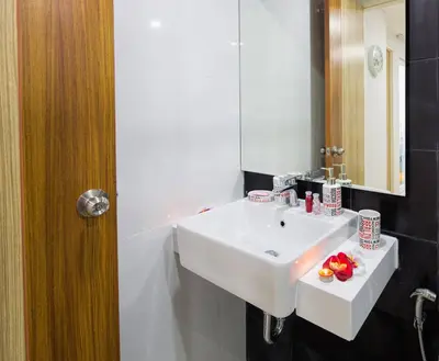 a bathroom with a white sink and a mirror at KATA BEACH OZONE Superb Fully Equipped studio kitchen washing machine aircon in Kata Beach