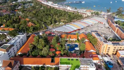 an aerial view of a city with a resort at Phuket Leelavadee Hua Ting Resort in Patong Beach