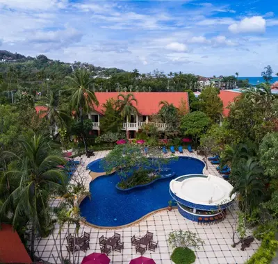an aerial view of a resort with a swimming pool at Phuket Leelavadee Hua Ting Resort in Patong Beach