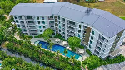 an aerial view of a building with a swimming pool at Title V by Villacarte in Rawai Beach