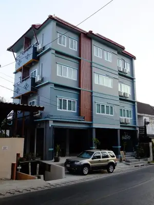 a car parked in front of a building at Kata Bai D - SHA Certificate Hotel in Kata Beach