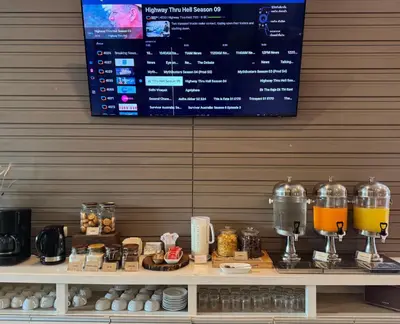 a counter with two wine glasses and a menu at Centro One Patong in Patong Beach