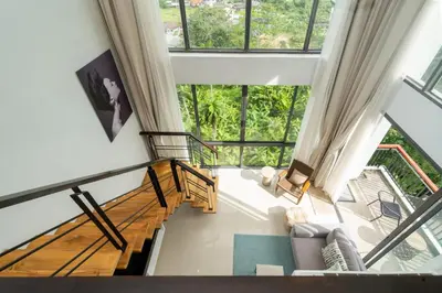 an overhead view of a living room with large windows at Deluxe apartment at Icon Park by Lofty in Kamala Beach