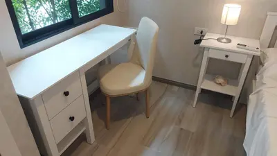 a bedroom with a desk and a chair next to a bed at Cozy Apartment Close to Amazing Beach ! 39 Sqm in Phuket Town