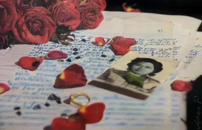 a sheet of paper with a picture of a girl and red roses at Artist Homestay in Ko Yao Noi