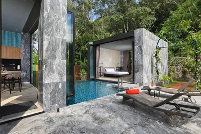 a house with a swimming pool in the backyard at Seclusion in the mountains, villa near Kamala beach in Kamala Beach