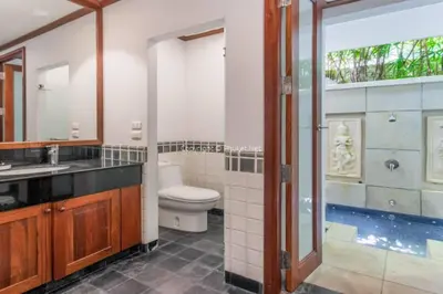 a bathroom with a toilet and a sink and a shower at Villa Mauao - Luxury Villa in Katamanda, Kata in Kata Beach