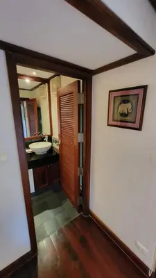 a room with a bathroom with a sink and a mirror at Villa Mauao - Luxury Villa in Katamanda, Kata in Kata Beach