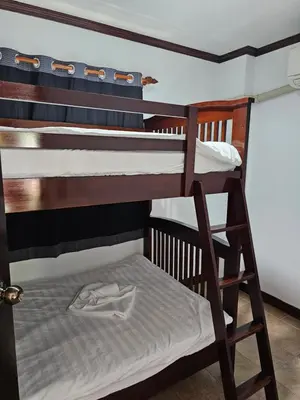 a couple of bunk beds in a room at Sai Rougn apartment in Patong Beach