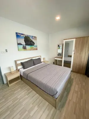 a bedroom with a large bed in a room at Apartment Sea View Patong Beach in Patong Beach
