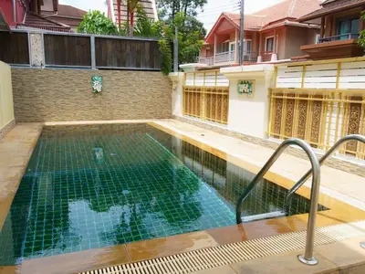 a swimming pool in the middle of a house at 4BD Private pool villa in Patong heart quiet&nice in Patong Beach