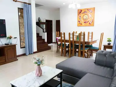 a living room with a couch and a table at 4BD Private pool villa in Patong heart quiet&nice in Patong Beach