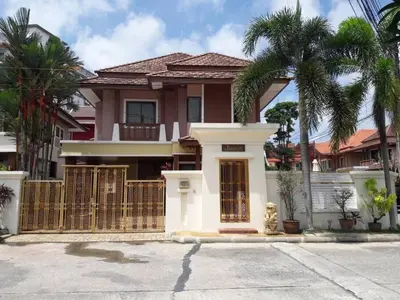 a house with a fence and palm trees at 4BD Private pool villa in Patong heart quiet&nice in Patong Beach
