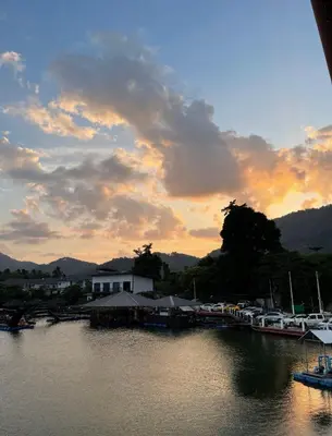 a sunset over a marina with boats in the water at Cozy Home With Lake View at Kathu PHUKET 3 BR in Ban Huai Luk (1)