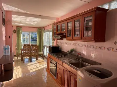 a kitchen with a sink and a stove top oven at Cozy Home With Lake View at Kathu PHUKET 3 BR in Ban Huai Luk (1)